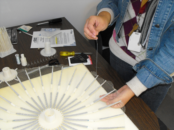 Threading a microsatellite sail