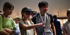 Engineering Student showing High School Student Holo Lens