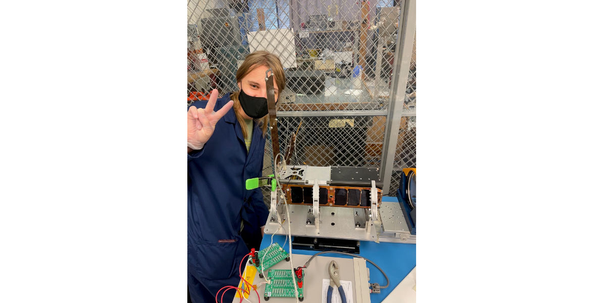 Engineer Working on Satellite