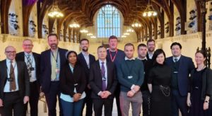 Group of people dressed formally inside large hall
