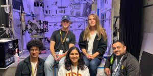 Group of students in front of satellite photoshoot setup