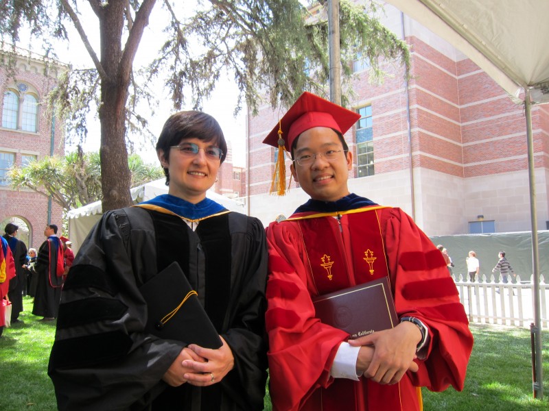 Kristina Lerman standing next to graduating student wearing cap and gown