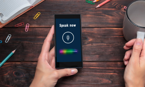 Person Holding Phone in their Hand with Speak Now Message