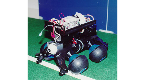 Cube robot with wheels and circuits on top