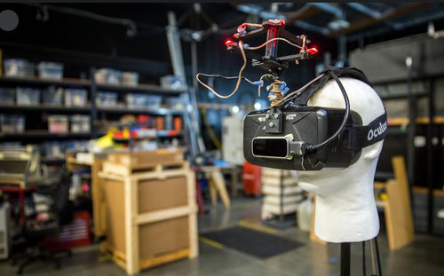 VR headset worn by a mannequin head with sensors attached to the headset