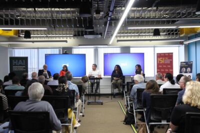 AI Index panel room with guests
