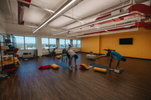 Yoga room with people practicing yoga
