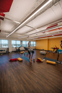 Yoga room with people practicing yoga